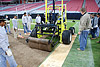 Crew rolling sod onto the field at the Arizona cardinals stadium before the game